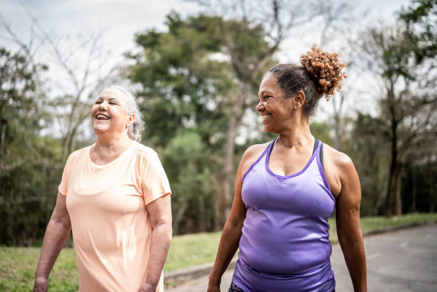istock Senior women walking in a park 1415794382