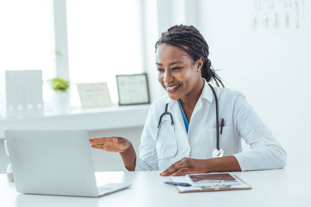 istock African American Physician is Making a Video Call with a Patient 1415794677