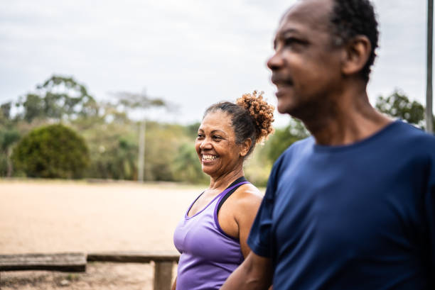 istock Senior couple walking in a park 1415795358