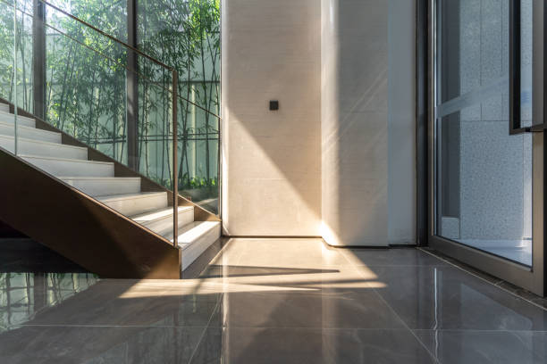 the sun shines on the stairs inside - black ladder white staircase imagens e fotografias de stock