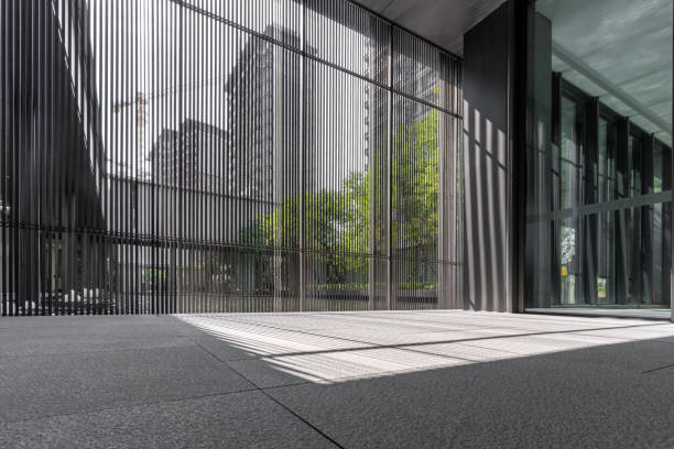 The light and shadow formed by the sunlight on the ceramic floor through the glass wall