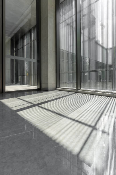 istock The light and shadow formed by the sunlight on the ceramic floor through the glass wall 1415796360
