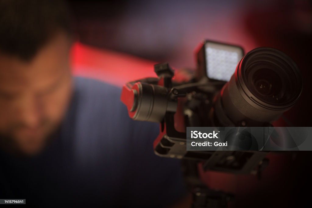 Content creator during filming with camera and gimbal Film Industry Stock Photo