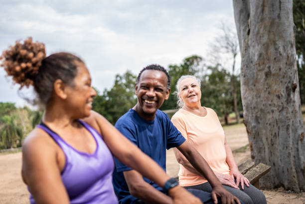 istock Senior friends talking in a park 1415796812