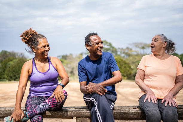 istock Senior friends talking in a park 1415796817