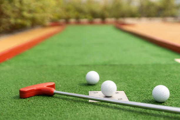 istock Mini-golf ball on artificial grass. Summer season game 1415800591