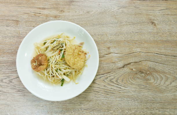 istock fried bean sprout with slice egg tofu and chop pork in plate 1415800638