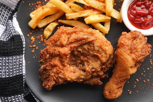 Deep fried crispy chicken with hot chips and tomato sauce