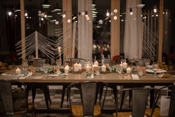 istock Christmas evening. Stylish table design. Serving with candles, eucalyptus, garlands and white plates. High quality photo 1415804970