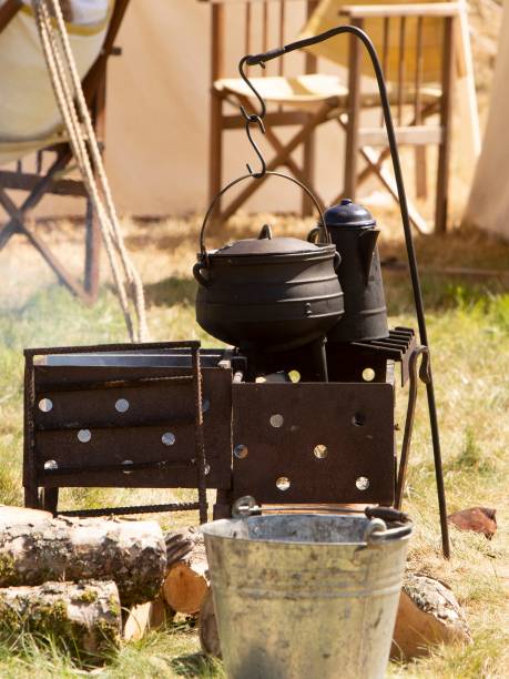 istock Colonial Era Campfire & Metal Cooking Pot. 1415805023