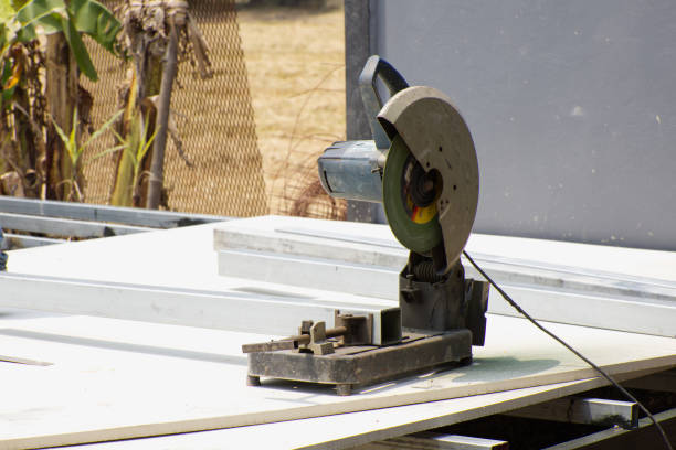 istock A metal cutting machine on white board in natural daylight. 1415809048