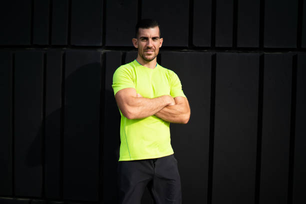 istock Confident sportsman with crossed arms looking at camera 1415809176