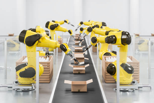 istock Robots at a conveyor belt packing items into cardboard packages. 1415809666