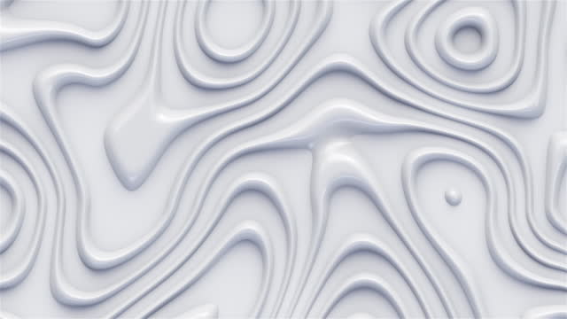 Wavy abstract surface. Close-up of a shiny smooth white wavy surface.