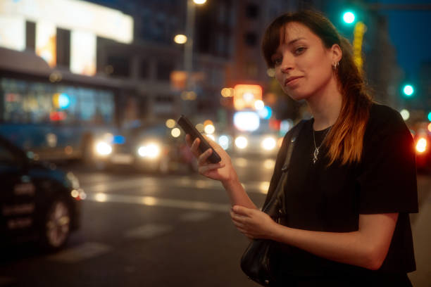 istock Woman using smartphone in the city 1415814136