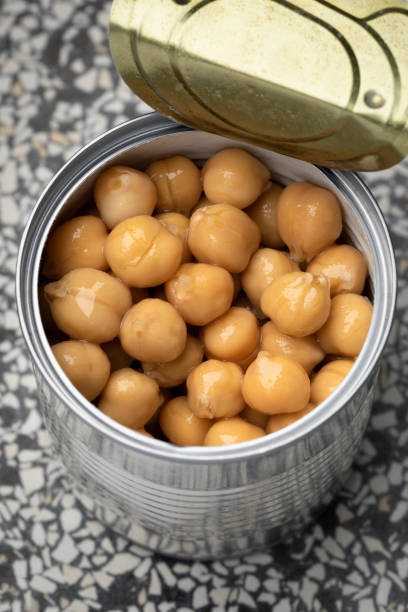 istock Open tin can with preserved chickpeas close up 1415814246