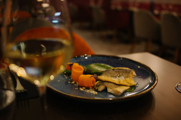 istock Delicious appetizer with glass of wine on table 1415816923