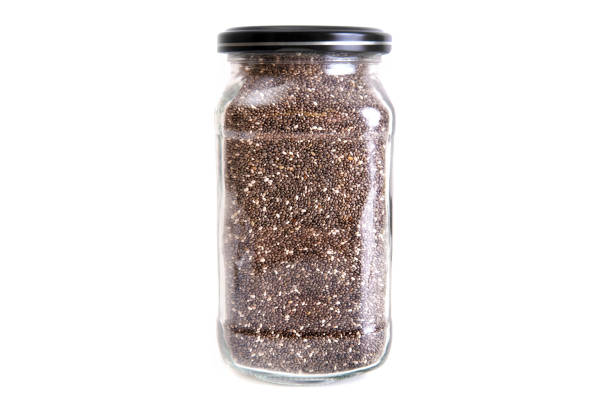 istock Jar of dry chia seeds isolated on white 1415818852