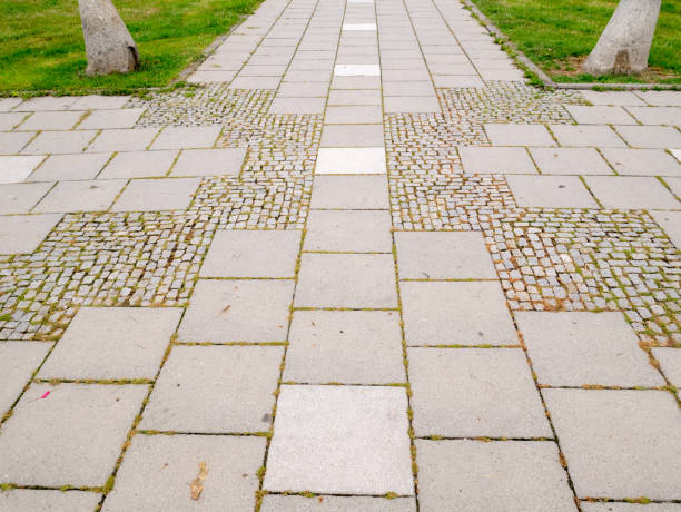 istock Cobblestone road in the park. 1415820143