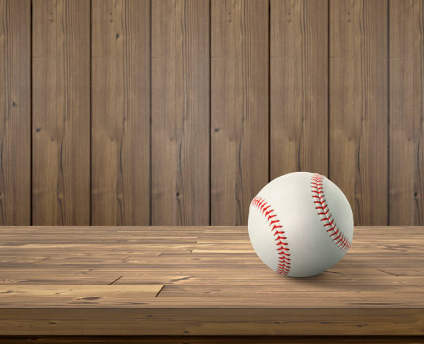 Baseball ball on wooden background Baseball ball on wooden background spring training stock pictures, royalty-free photos & images
