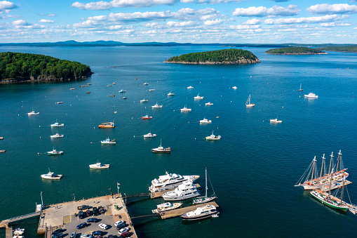 Aerial View of boats anchored offshore in Bar Harbor Maine on a sunny day with islands