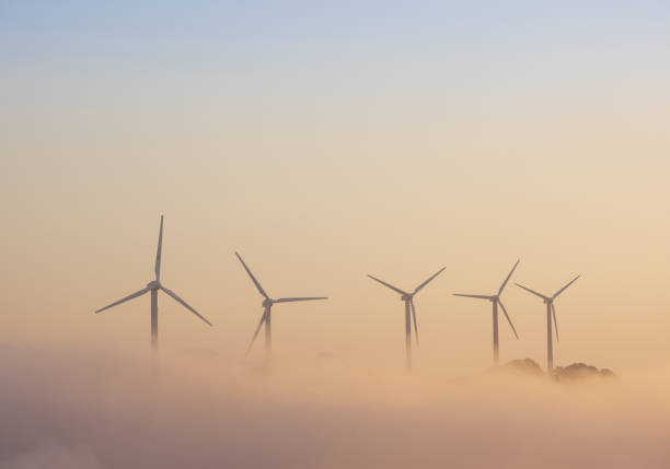 istock Wind turbines above the clouds at sunset 1415823862