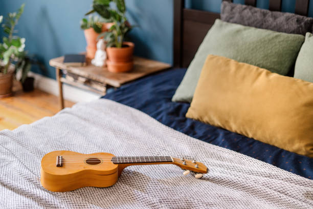 istock ukulele on bed in bedroom with bohemian interior 1415825003