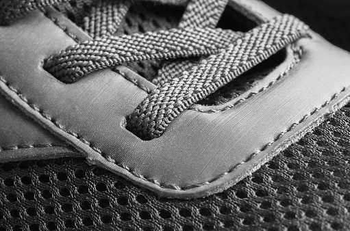 A fragment of a black sneaker. Close-up