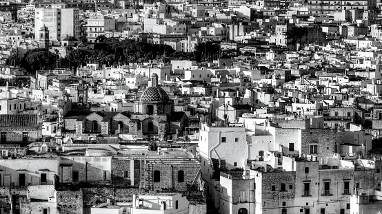 Overview of Ostuni (BR), the white city perched on the hill, with the typical white houses. Aerial photo with the drone of June 2022 photo taken at dawn