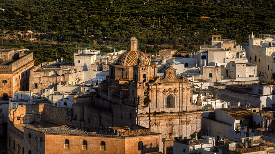 Overview of Ostuni (BR), the white city perched on the hill, with the typical white houses. Aerial photo with the drone of June 2022 photo taken at dawn