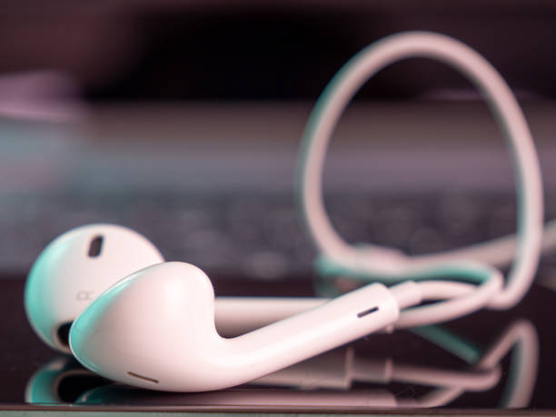 istock Smartphone has white headphones with a cable. 1415827192