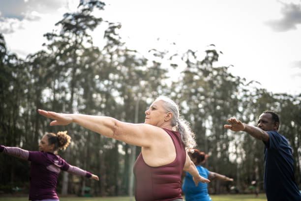 istock Senior friends exercising in a park 1415828711