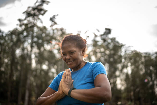 istock Senior woman in a park 1415829462