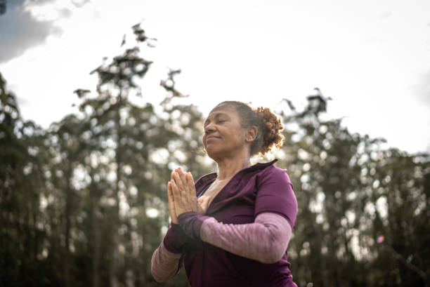 istock Senior woman in a park 1415829468