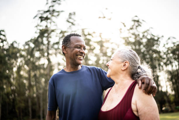 istock Senior couple looking at each other in a park 1415829623