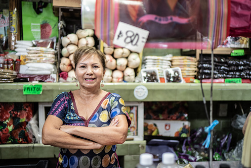 Portrait of mature woman retail shop owner at her market store