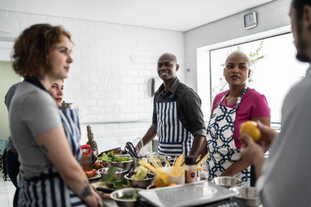 istock Chef giving instructions to adult students in a cooking class 1415832110