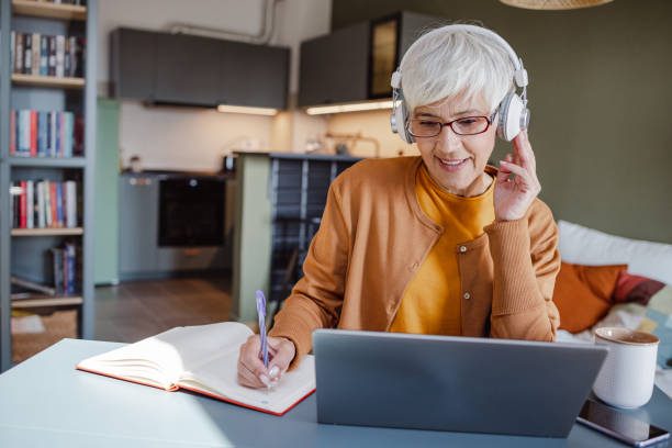 istock Senior woman attending educational online course 1415832205