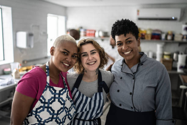 istock Portrait of a chef and students in a kitchen during a cooking class 1415832306