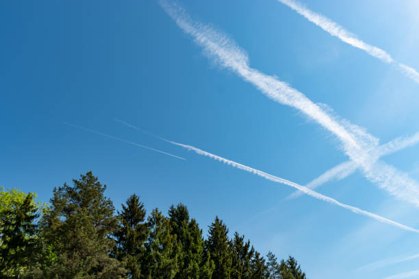 istock Contrails in the blue sky over Switzerland 1415833019