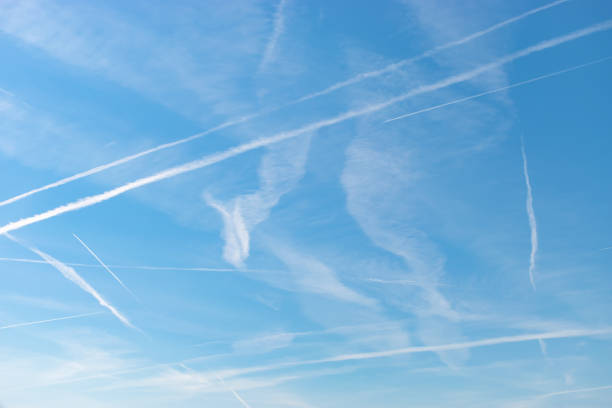 istock Contrails in the blue sky over Switzerland 1415833058