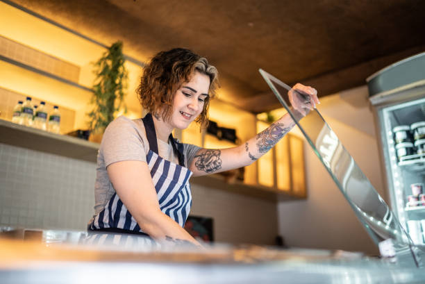 istock Woman working in an ice cream shop 1415833266
