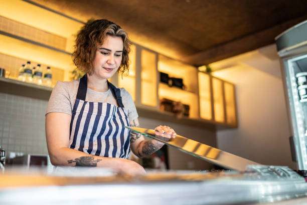istock Woman working in an ice cream shop 1415833273
