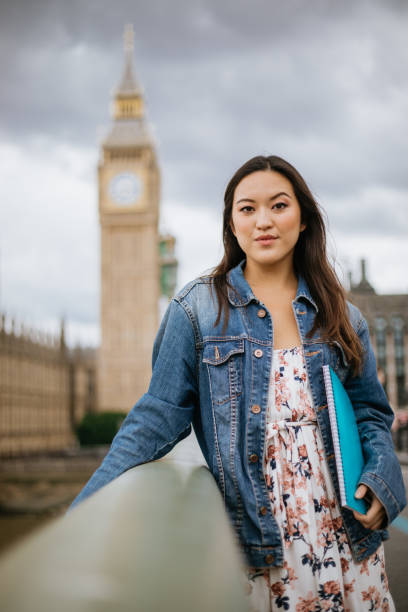 Happy Asian female student in London stock photo