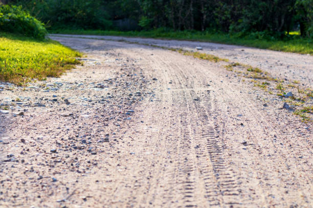 istock Gravel road 1415836388