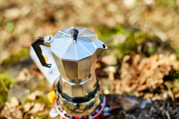 istock Making camping coffee from a geyser coffee maker on a gas burner 1415837360