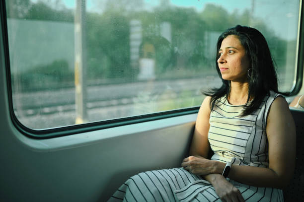 istock Woman enjoying a train journey 1415837485
