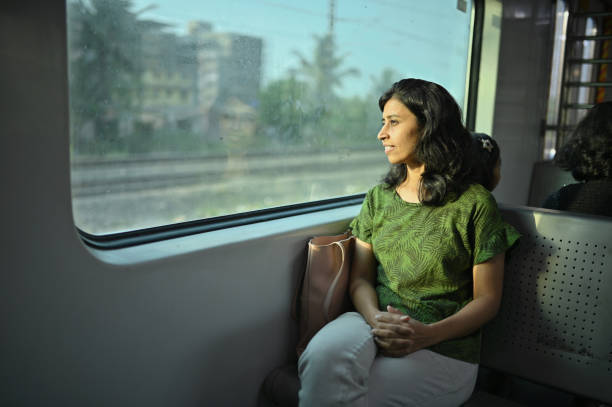 istock Woman enjoying a train journey 1415837497