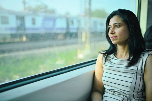 istock Woman enjoying a train journey 1415837502