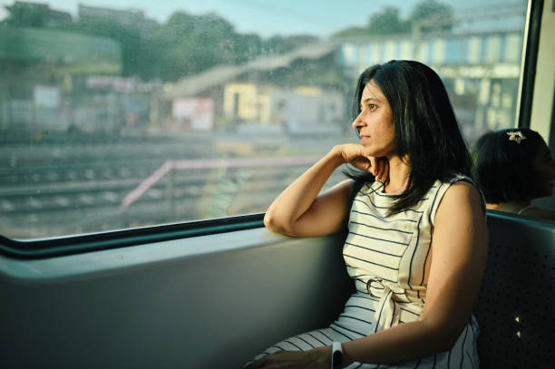 istock Woman enjoying a train journey 1415837518